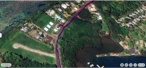 an overhead view of a road next to a river at Tiny House Moorea Hinavai in Papetoai