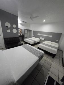 Postel nebo postele na pokoji v ubytování Hotel Raga Inn