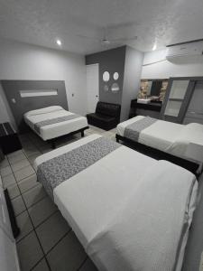 Postel nebo postele na pokoji v ubytování Hotel Raga Inn