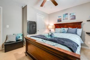 a bedroom with a large bed with a wooden headboard at Ellenwood Family Home Fire Pit, Deck and Pool Table in Ellenwood