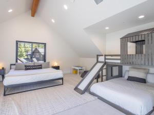 a bedroom with two bunk beds and a staircase at Suncadia 3 Bdrm Home w/Bonus room + Game room in Cle Elum +29 photos