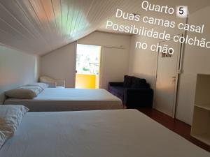 Ένα ή περισσότερα κρεβάτια σε δωμάτιο στο Chácara Paraíso do Rock