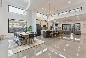 a dining room and living room in a house at By Sand Hollow Rooftop Patio & Private Hot Tub in Hurricane