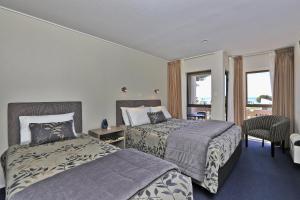 Ένα ή περισσότερα κρεβάτια σε δωμάτιο στο Edgewater Motor Lodge