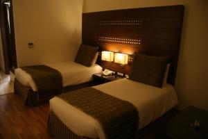 Postel nebo postele na pokoji v ubytování Bamyan The Boutique Hotel