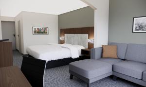 Postel nebo postele na pokoji v ubytování Quality Suites