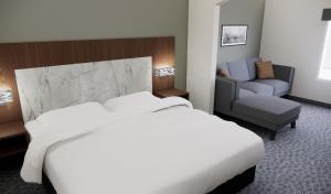 Postel nebo postele na pokoji v ubytování Quality Suites