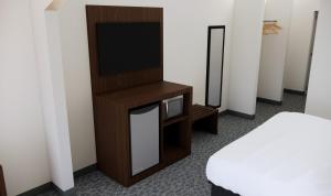 Postel nebo postele na pokoji v ubytování Quality Suites