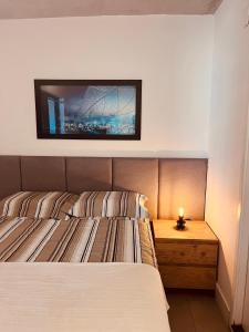 Postel nebo postele na pokoji v ubytování Studio Moderno no Centro - Check-in Digital e Wi-Fi Rápido