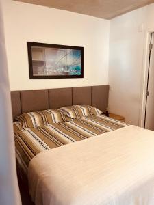 Postel nebo postele na pokoji v ubytování Studio Moderno no Centro - Check-in Digital e Wi-Fi Rápido
