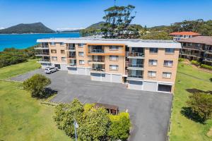 an overhead view of an apartment building with a parking lot at Promenade 11, 8 Intrepid Close - air conditioned unit with beautiful water views in Shoal Bay