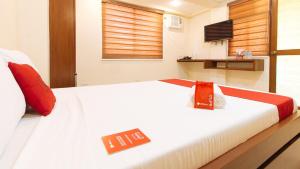 Voodi või voodid majutusasutuse RedDoorz Plus near Uptown BGC Mall toas