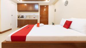 Voodi või voodid majutusasutuse RedDoorz Plus near Uptown BGC Mall toas
