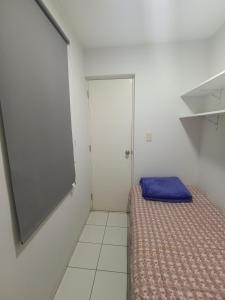 a small room with a bed and a closet at MIRAFLORES APART-10Beds-11Persons-Pool-Grill-Garage-Near Kennedy Park in Lima