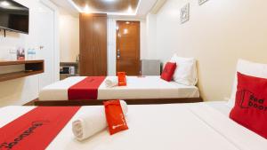 Voodi või voodid majutusasutuse RedDoorz Plus near Uptown BGC Mall toas