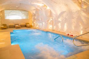 an indoor pool with clouds in the ceiling at Hotel La Fonda in Benalmádena
