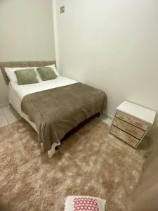 Ένα ή περισσότερα κρεβάτια σε δωμάτιο στο Apartamento no Centro da Cidade Nova- 4 min do Aeroporto