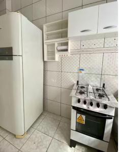 Η κουζίνα ή μικρή κουζίνα στο Apartamento no Centro da Cidade Nova- 4 min do Aeroporto