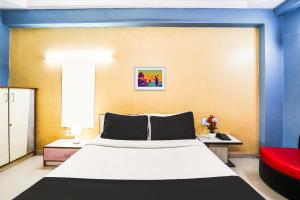 Postel nebo postele na pokoji v ubytování Super Hotel O Vibrant Residency