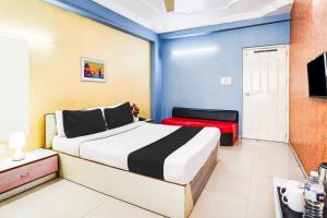 Postel nebo postele na pokoji v ubytování Super Hotel O Vibrant Residency