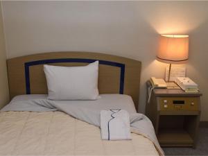 Postel nebo postele na pokoji v ubytování Silk Hotel