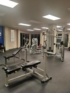 a gym with several tread machines in a room at Veloche Karon 12 in Karon Beach