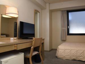 TV a/nebo společenská místnost v ubytování Silk Hotel