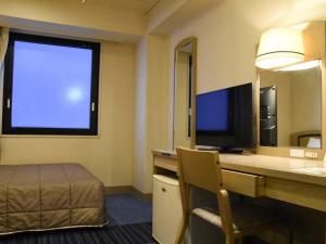 TV a/nebo společenská místnost v ubytování Silk Hotel