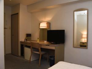 TV a/nebo společenská místnost v ubytování Silk Hotel