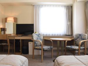 TV a/nebo společenská místnost v ubytování Silk Hotel