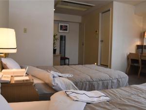 Postel nebo postele na pokoji v ubytování Silk Hotel