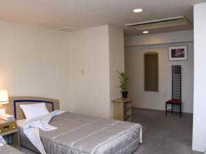 Postel nebo postele na pokoji v ubytování Silk Hotel