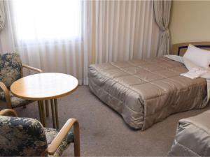 Postel nebo postele na pokoji v ubytování Silk Hotel