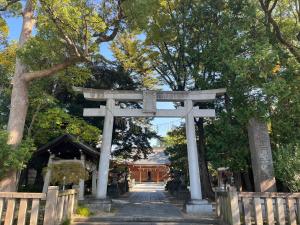 a torii gate at the entrance to a shrine at Shine house warabi in Warabi