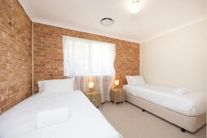 Ένα ή περισσότερα κρεβάτια σε δωμάτιο στο Castaway on King George