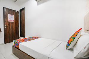 Postel nebo postele na pokoji v ubytování FabHotel Elvis Inn - Nr Mumbai International Airport
