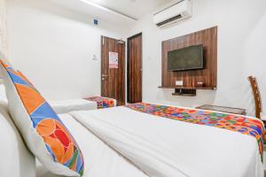 Postel nebo postele na pokoji v ubytování FabHotel Elvis Inn - Nr Mumbai International Airport