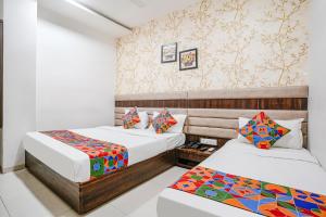 Postel nebo postele na pokoji v ubytování FabHotel Elvis Inn - Nr Mumbai International Airport