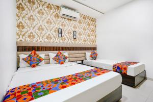 Postel nebo postele na pokoji v ubytování FabHotel Elvis Inn - Nr Mumbai International Airport