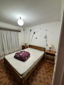 Una cama o camas en una habitación de Hospedaje Quilimari Alto