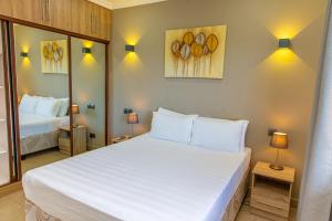 Postel nebo postele na pokoji v ubytování B Holiday Apartments