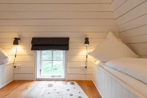 Postel nebo postele na pokoji v ubytování Tofthof Lütte Tofthof