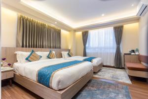 Letto o letti in una camera di Shuvatara Suites & Spa, Thamel