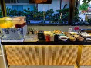 a counter with food and drinks on it at Aria Riva Apart Hotel in Alanya
