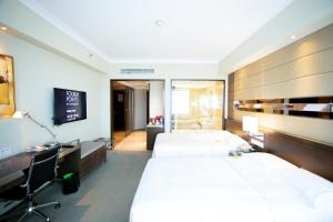 Postel nebo postele na pokoji v ubytování Four Points By Sheraton Beijing, Haidian