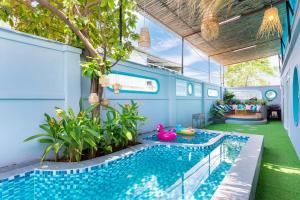 a house with a swimming pool in the middle of a yard at Villa VTS - Gần Biển Thùy Vân - Free Karaoke in Vung Tau +13 photos