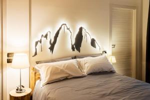 Postel nebo postele na pokoji v ubytování Agriturismo La Dolza