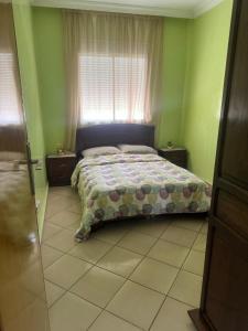 Ένα ή περισσότερα κρεβάτια σε δωμάτιο στο Agadir jet sakane 1 er étage