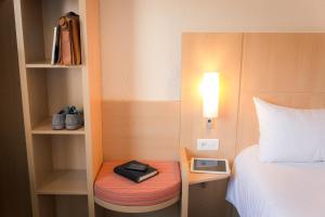 Postel nebo postele na pokoji v ubytování ibis Grenoble Gare