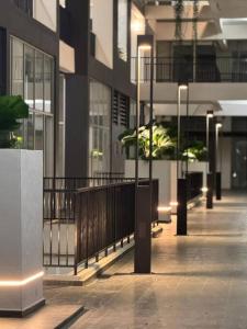 an empty hallway of a building with lights on at Amani Staycation Bandar Seri Alam#Studio in Masai +20 photos